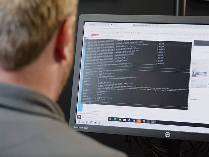 A man looking at a computer.