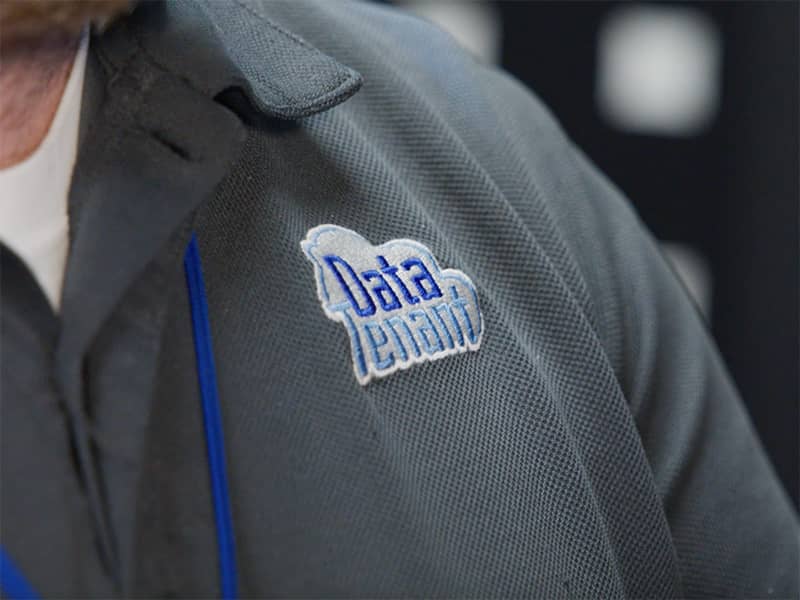 A close up of a man's shirt reading DataTenant.